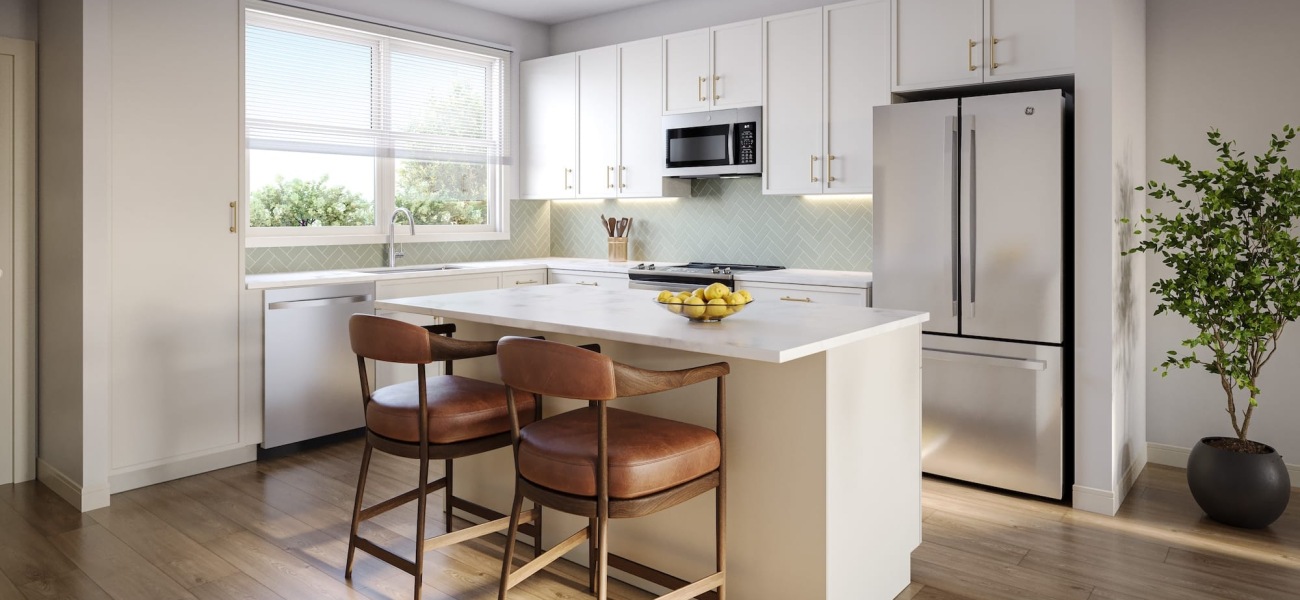 a kitchen with bar style seating and natural lighting